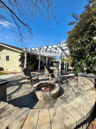 a view of a patio with swimming pool table and chairs