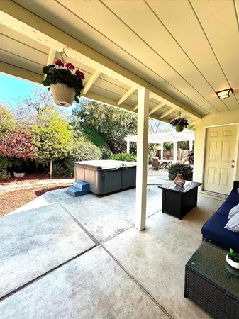 a living room filled with furniture and a large window