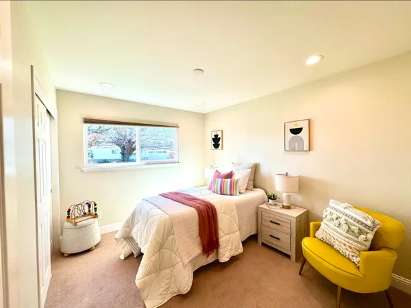 a bed room with a bed and a couch