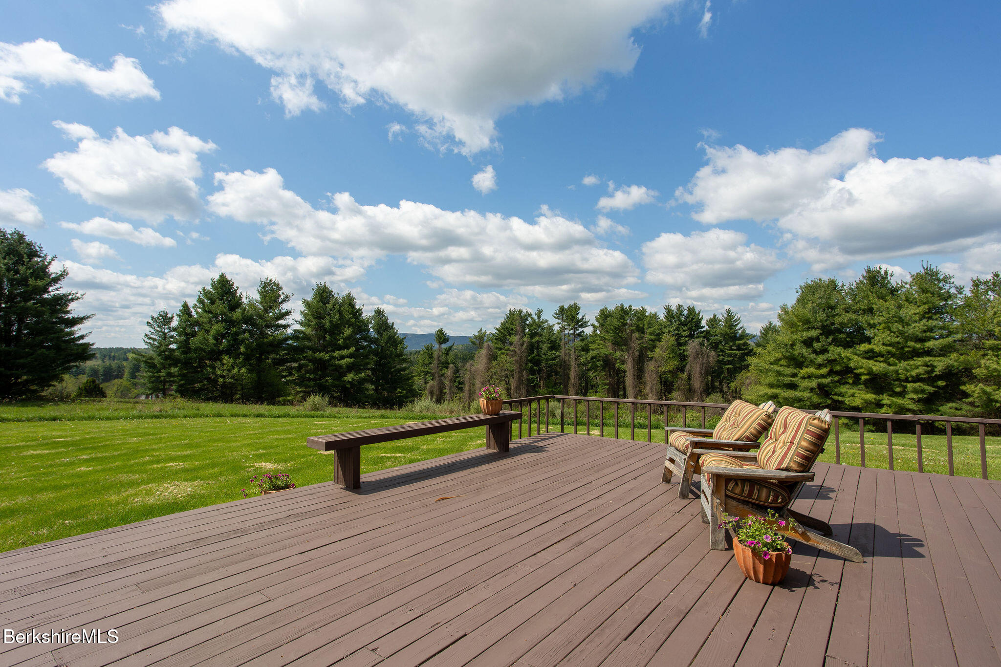 77 Hurlburt Road Great Barrington, MA 01230 - Photo 6 of 48 a view of a bench in a yard