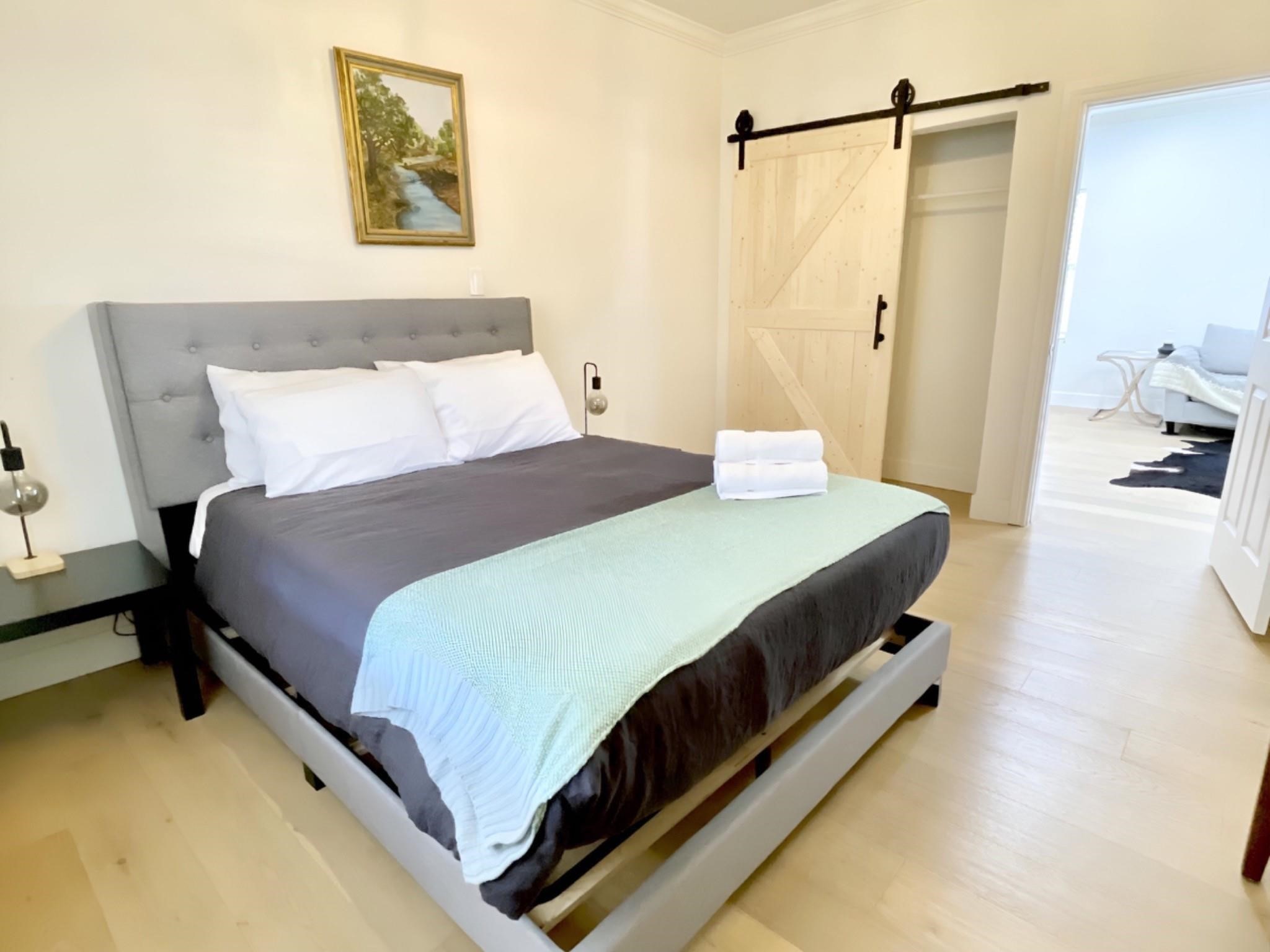 301 Tabor Street Houston, TX 77009 - Photo 11 of 14 a bedroom with a bed and a walk in closet