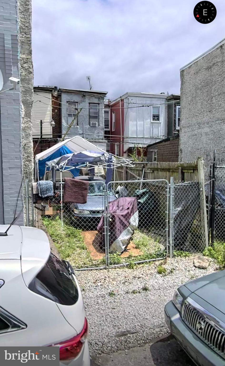 a backyard of a house with barbeque oven