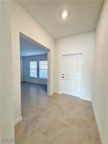 a bathroom with a sink mirror and toilet