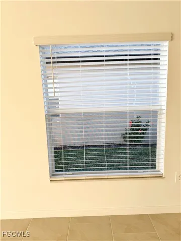 a view of a door and a window