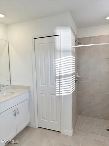 a bathroom with a shower and a sink
