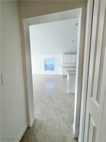 an empty room with a empty space and window