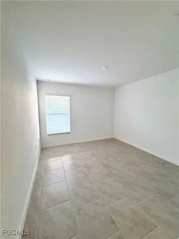 a spacious bathroom with a double vanity sink and a mirror