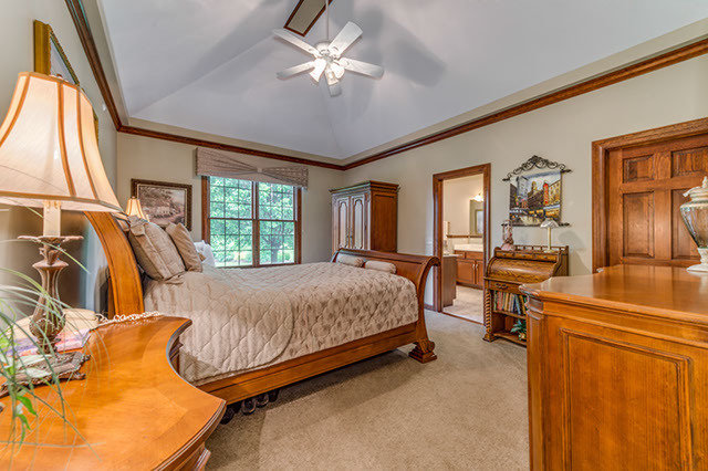 4N446 School Road St. Charles, IL 60175 - Photo 11 of 25 a bed room with a bed and a chandelier