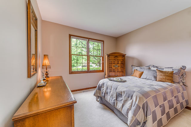 4N446 School Road St. Charles, IL 60175 - Photo 14 of 25 a bedroom with a bed and a window
