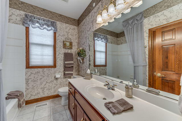 4N446 School Road St. Charles, IL 60175 - Photo 15 of 25 a bathroom with a sink and a mirror