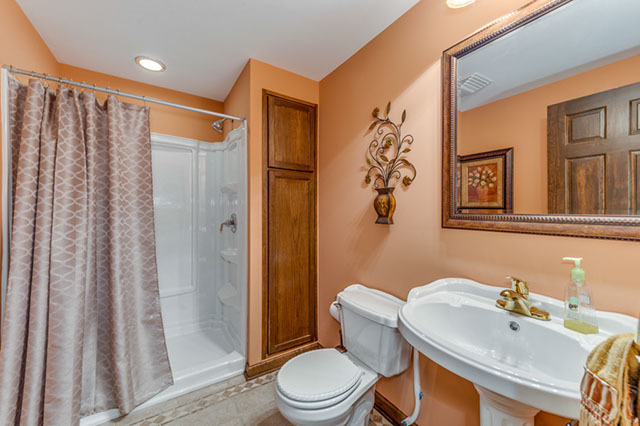 4N446 School Road St. Charles, IL 60175 - Photo 21 of 25 a bathroom with a sink toilet and shower