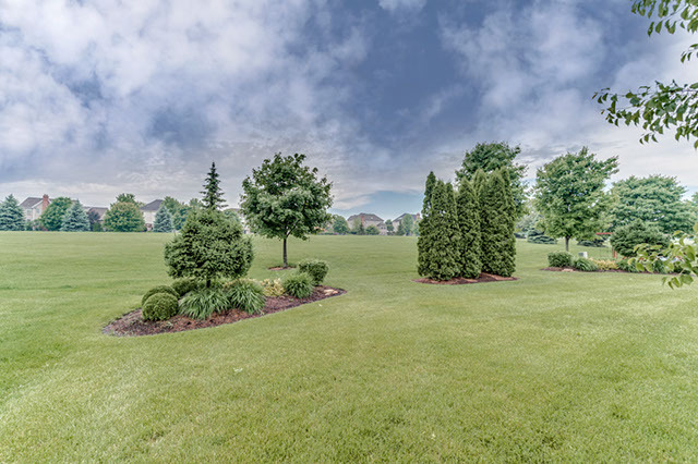 4N446 School Road St. Charles, IL 60175 - Photo 23 of 25 a view of a garden with a building in the background