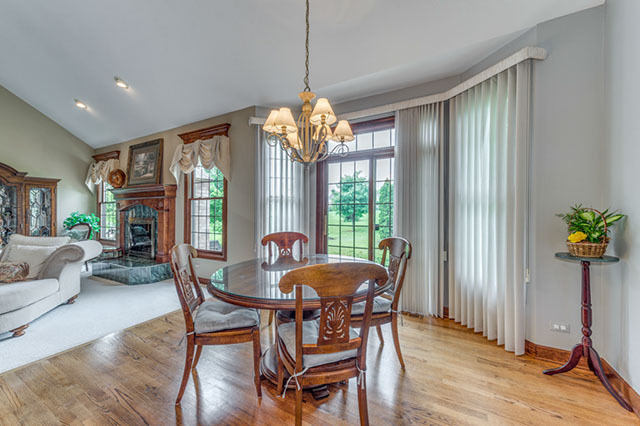 4N446 School Road St. Charles, IL 60175 - Photo 7 of 25 a view of a dining room with furniture window and wooden floor