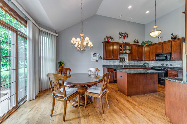 4N446 School Road St. Charles, IL 60175 - Photo 8 of 25 a view of a dining room with furniture window and wooden floor