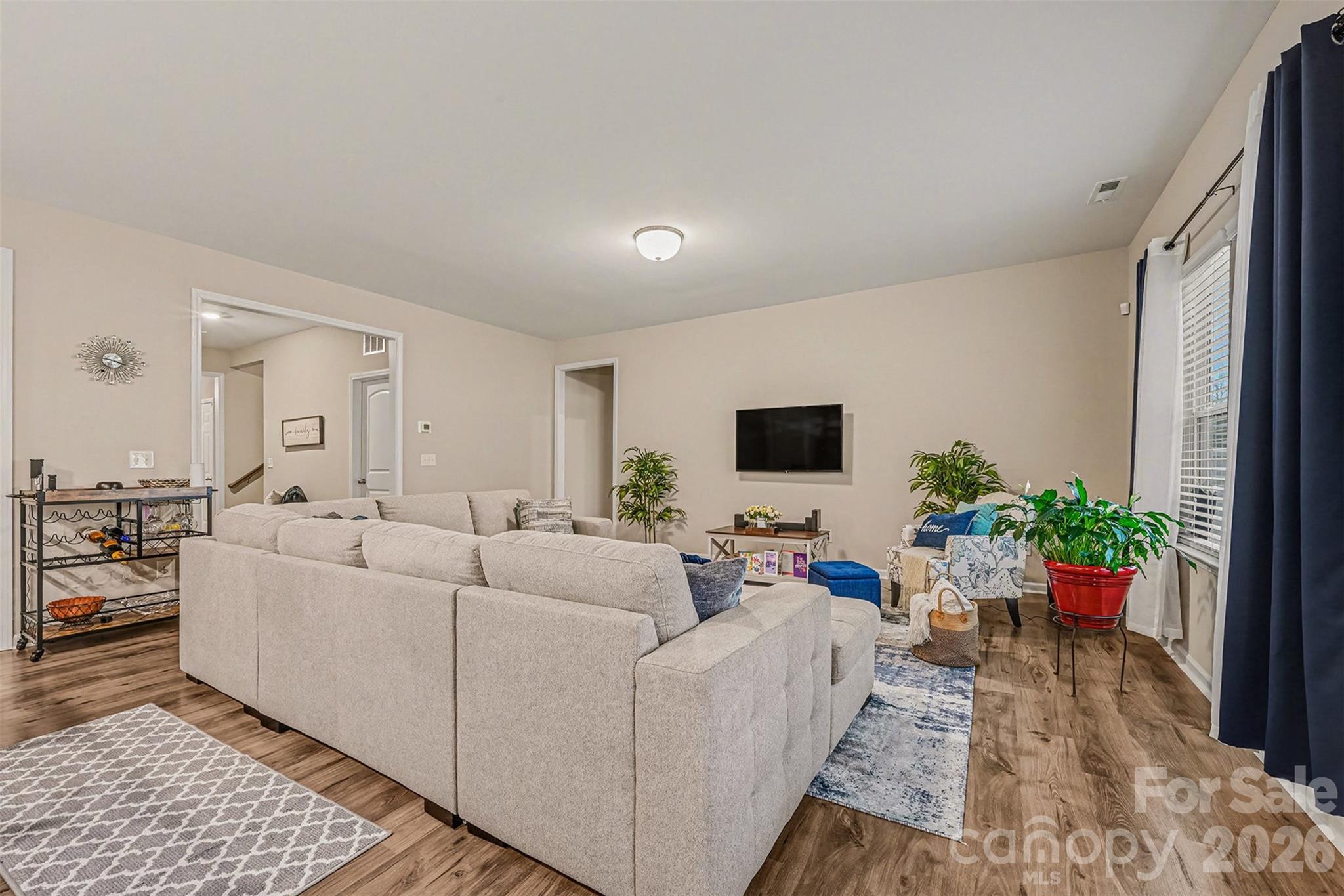 1772 Savannah Lane, Unit 19 Stanfield, NC 28163 - Photo 12 of 29 a living room with furniture potted plant and a window