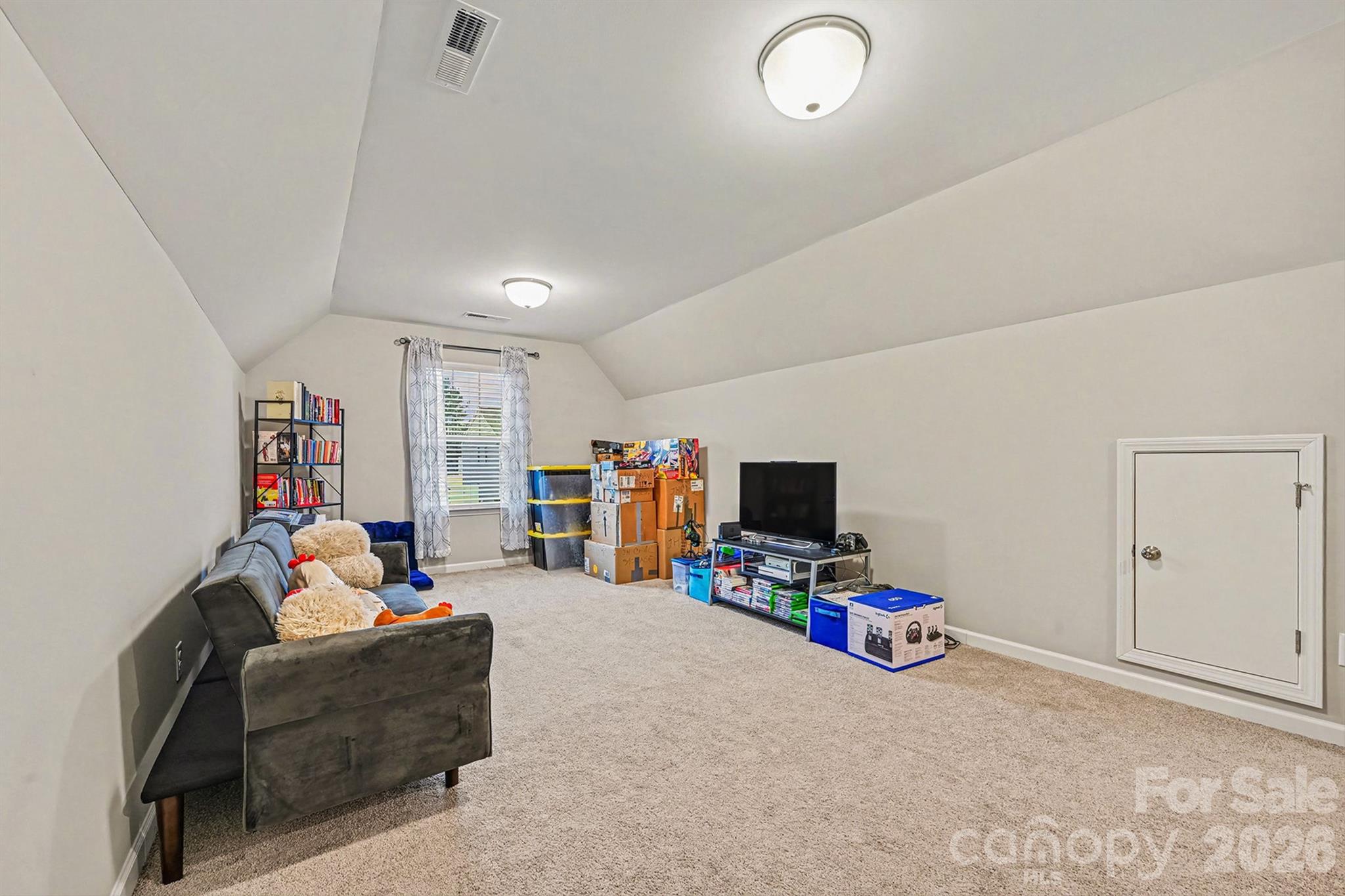 1772 Savannah Lane, Unit 19 Stanfield, NC 28163 - Photo 21 of 29 a living room with furniture and a flat screen tv