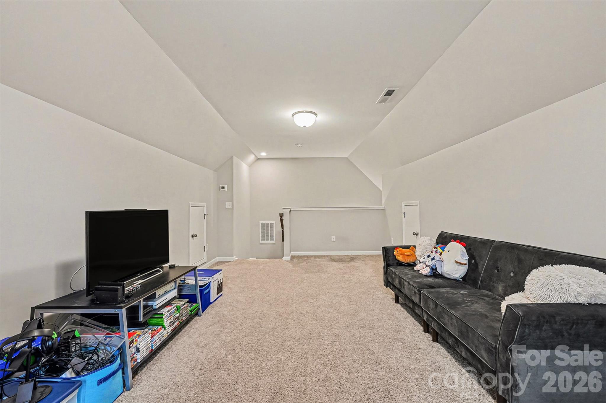 1772 Savannah Lane, Unit 19 Stanfield, NC 28163 - Photo 22 of 29 a living room with furniture and a flat screen tv