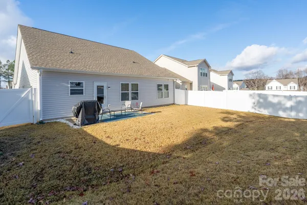 a house view with swimming pool in front of it
