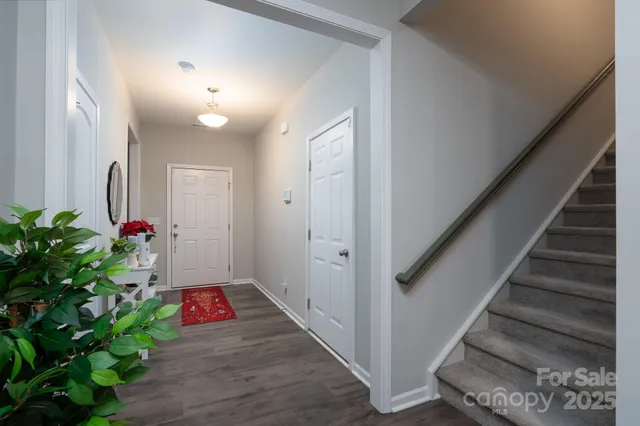 a view of entryway with wooden floor