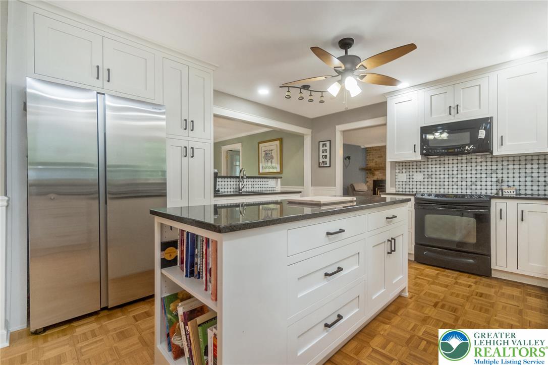 1553 Surrey Road Bethlehem, PA 18015 - Photo 11 of 92 A well-appointed kitchen features a large island and ample cabinetry, offering both style and functionality.