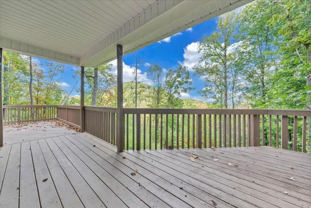 a view of balcony with wooden floor