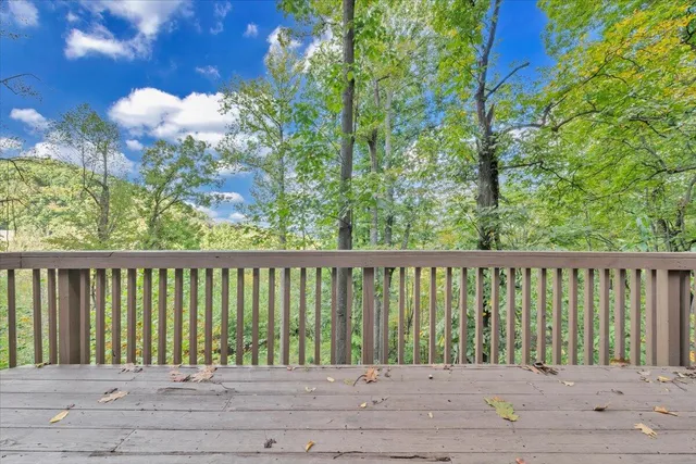 a balcony with wooden floor