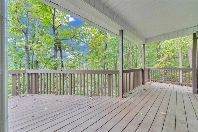 a view of balcony with wooden floor