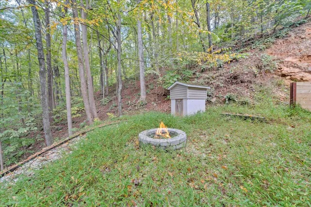 a backyard of a house with a table and chair
