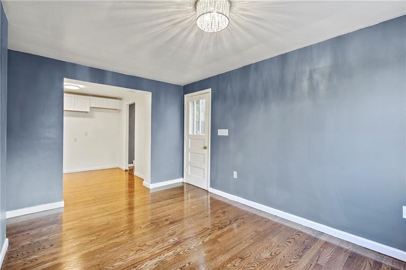 308 Frazier Drive Pittsburgh, PA 15235 - Photo 13 of 29 wooden floor in an empty room with a window