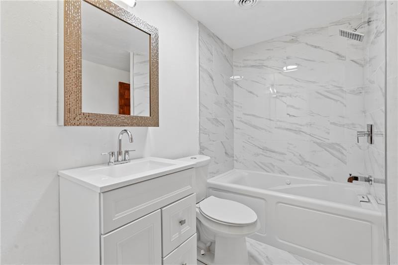 308 Frazier Drive Pittsburgh, PA 15235 - Photo 14 of 29 a bathroom with a sink toilet vanity and shower