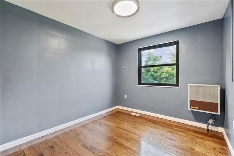 308 Frazier Drive Pittsburgh, PA 15235 - Photo 18 of 29 a view of room with window and wooden floor