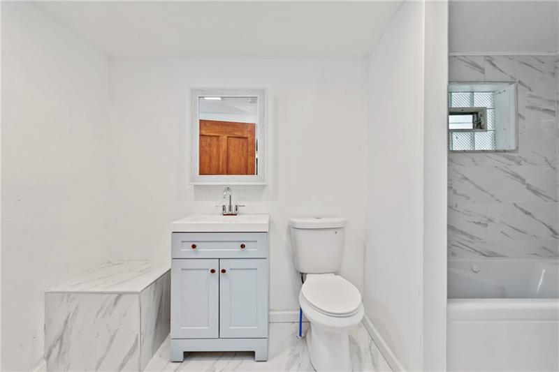 308 Frazier Drive Pittsburgh, PA 15235 - Photo 22 of 29 a bathroom with a toilet a sink and mirror