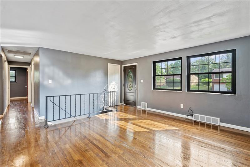 308 Frazier Drive Pittsburgh, PA 15235 - Photo 3 of 29 a view of an empty room with window and wooden floor