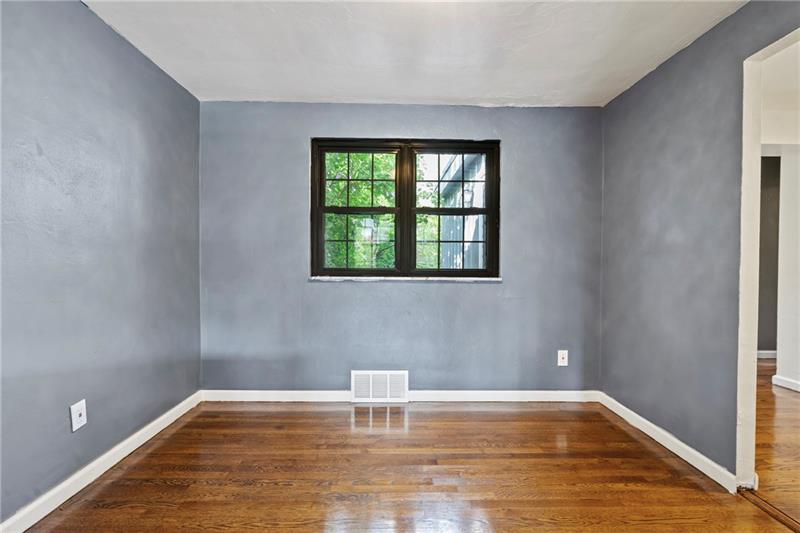 308 Frazier Drive Pittsburgh, PA 15235 - Photo 6 of 29 a view of empty room with wooden floor and fan