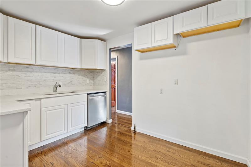 308 Frazier Drive Pittsburgh, PA 15235 - Photo 10 of 29 a kitchen with granite countertop white cabinets and white appliances