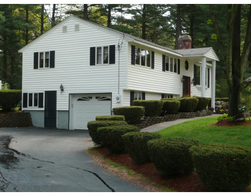 18 Governor Fuller Road Billerica, MA 01821 - Photo 26 of 30 a front view of a house with a garden