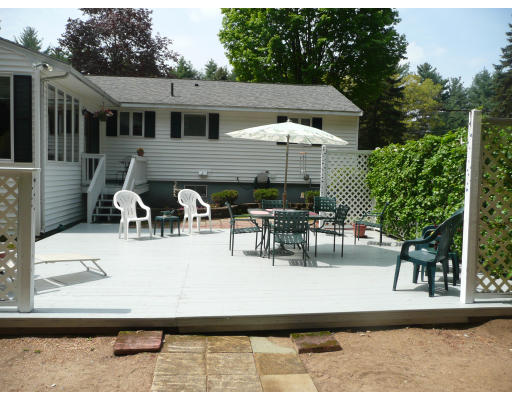 18 Governor Fuller Road Billerica, MA 01821 - Photo 30 of 30 a view of a patio with table and chairs potted plants with large tree