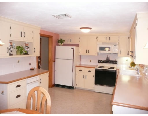 18 Governor Fuller Road Billerica, MA 01821 - Photo 7 of 30 a kitchen with stainless steel appliances a refrigerator sink and white cabinets