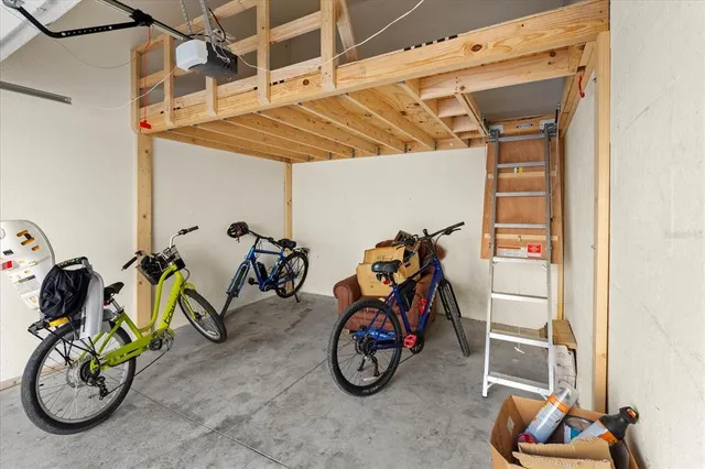 a view of a storage with a bike and car