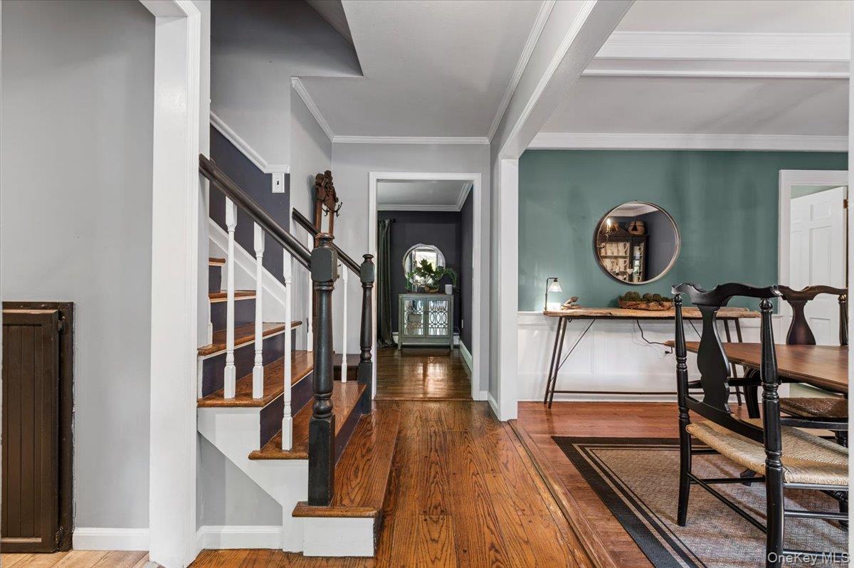 10 Rancher Place Huntington, NY 11743 - Photo 4 of 44 Entry foyer showcasing wood-finish flooring and a staircase with white risers and dark wood treads