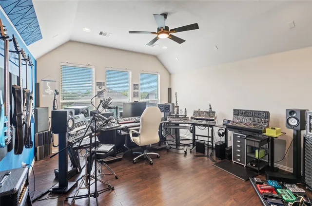 a work room with furniture and gym equipment