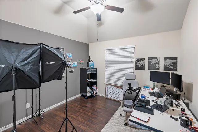 a bathroom with a sink a toilet a mirror and shower curtain