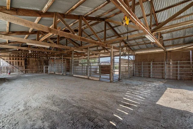 a view of empty room with wooden ceiling