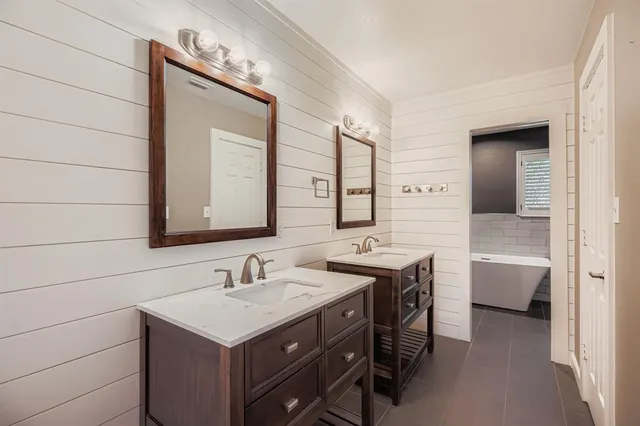 a bathroom with a bathtub and a shower