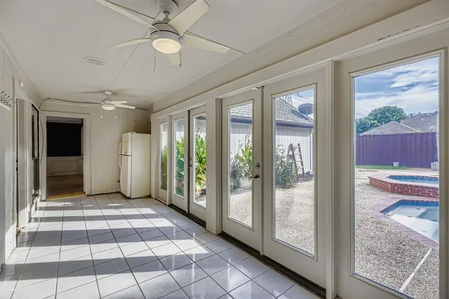 a view of a swimming pool with a patio