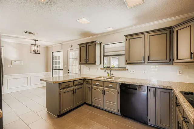 a kitchen with a sink stove and cabinets