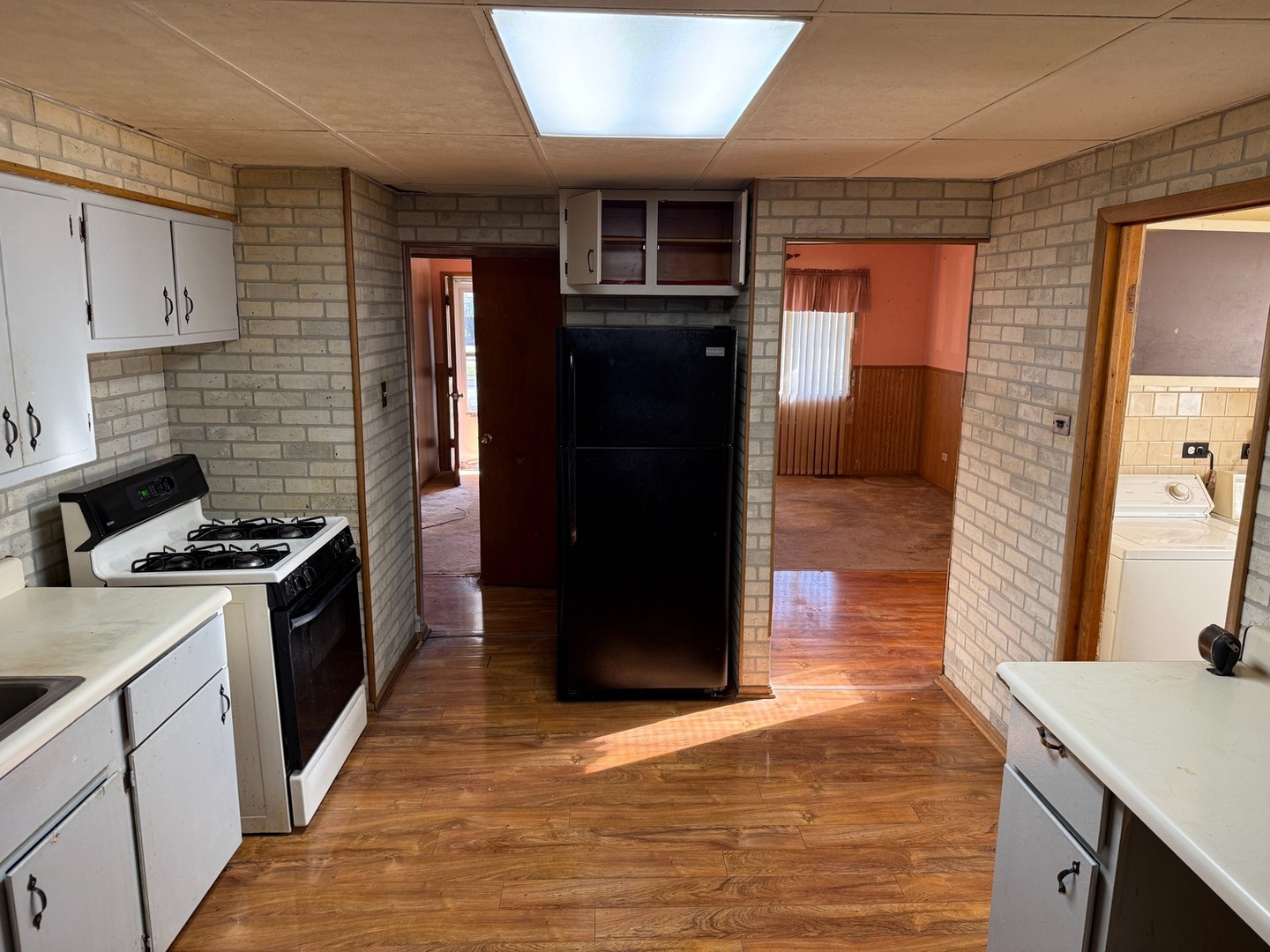 17226 Community Street Lansing, IL 60438 - Photo 13 of 25 a kitchen with stainless steel appliances granite countertop a stove and a refrigerator