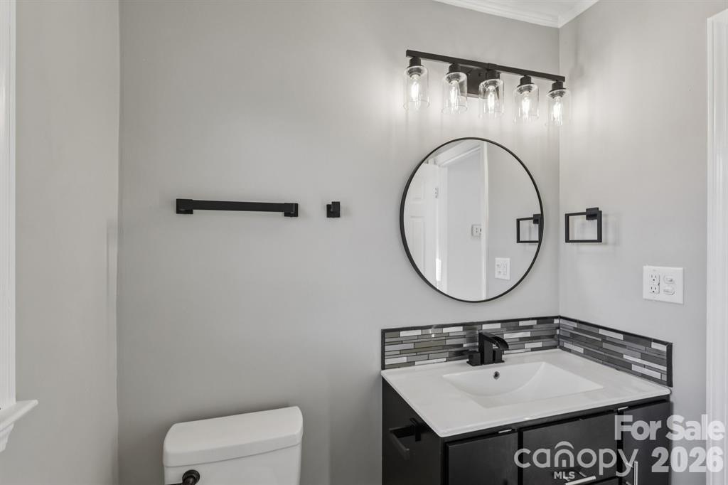 3207 Valley Dale Road Monroe, NC 28110 - Photo 16 of 27 a bathroom with a sink and a mirror