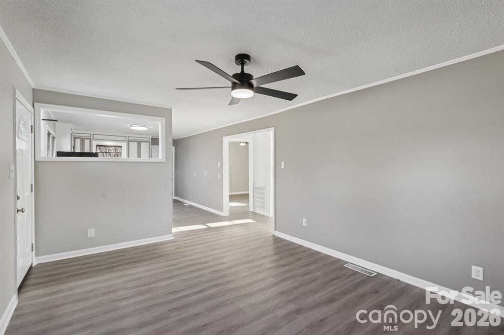 3207 Valley Dale Road Monroe, NC 28110 - Photo 22 of 27 a view of an empty room with wooden floor