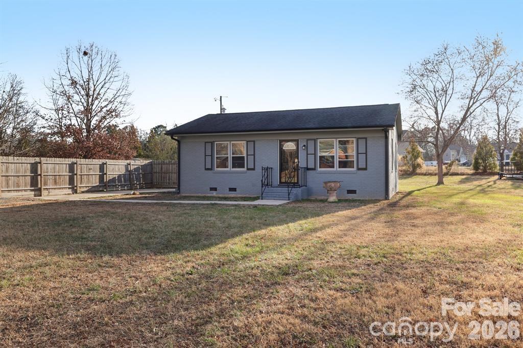 3207 Valley Dale Road Monroe, NC 28110 - Photo 3 of 27 a view of a house with backyard and trees